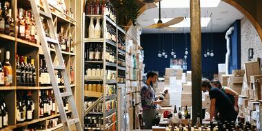 The bottle-lined shop floor of Le Cave de Belleville