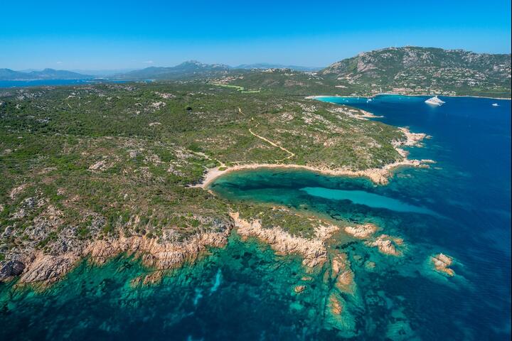 Undulating coastline of the Cervo Hotel beach.