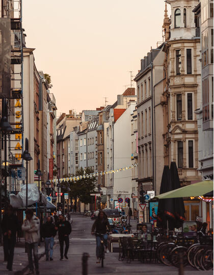 View down a Cologne street at dusk