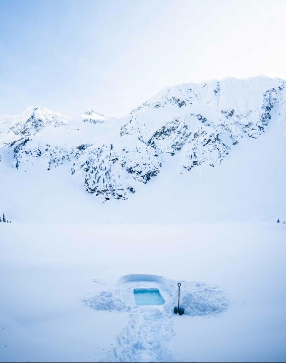 An icy plunge pool in snow