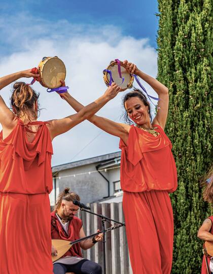 Women dancing at Braga Romana in Braga, Portugal