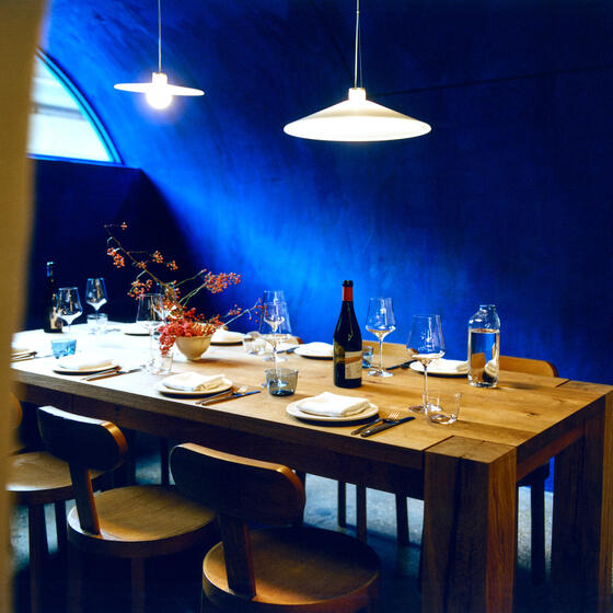 A vivid blue dining space