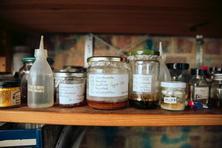 Jars on a wooden shelf