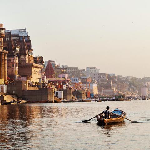 A rower on the Ganges River, India