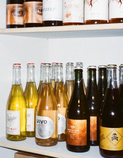 Natural wines on a white shelf