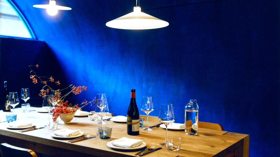 A vivid blue dining space