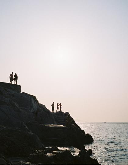 Shadows of swimmers in Hydra, Greece