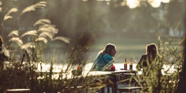 Two woman drinking beers