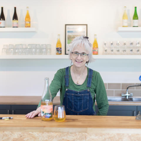 Founder of the cidery, Little Pomona, Susanna Forbes behind the bar