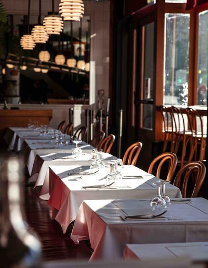 The wood-heavy dining room of Bouillon Pigalle in Paris, France