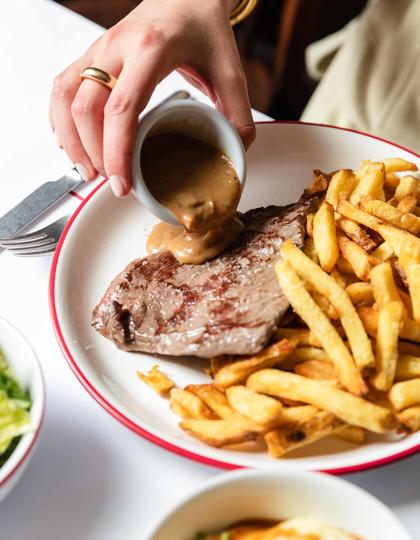 A steak and frites on offer at Bouillon Pigalle in Paris